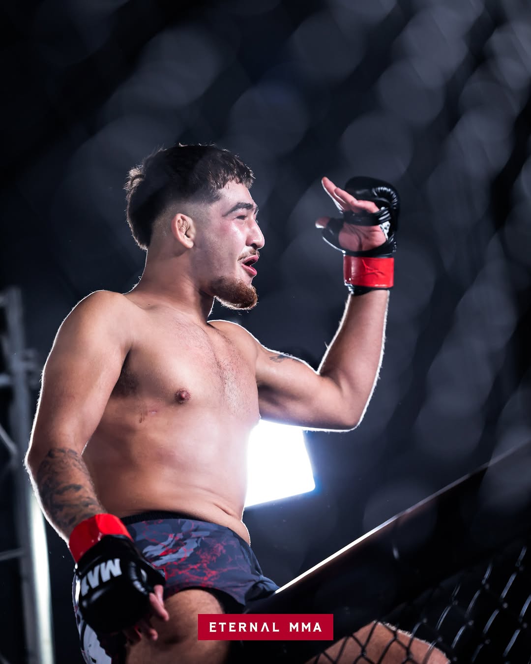 Kourosh Arvan points to the camera mid-fight