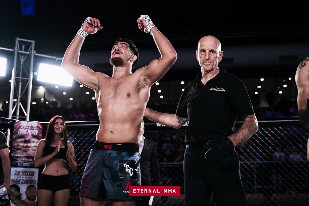 Kourosh Arvan, hand raised after the first-round knockout