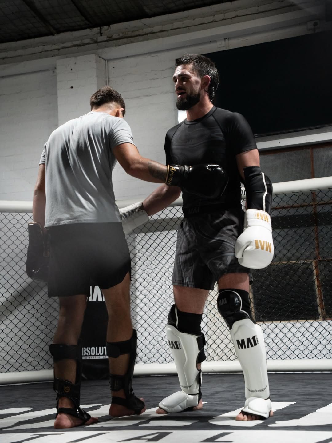Kourosh Arvan working pads with his coach