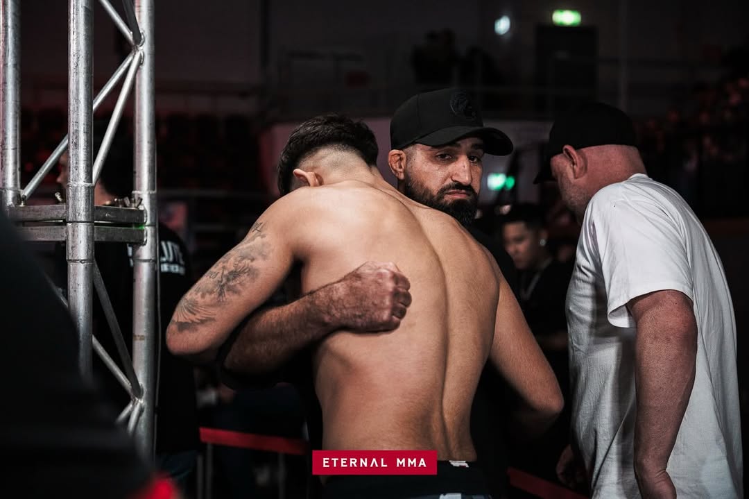 Kourosh Arvan with his coach backstage before the fight
